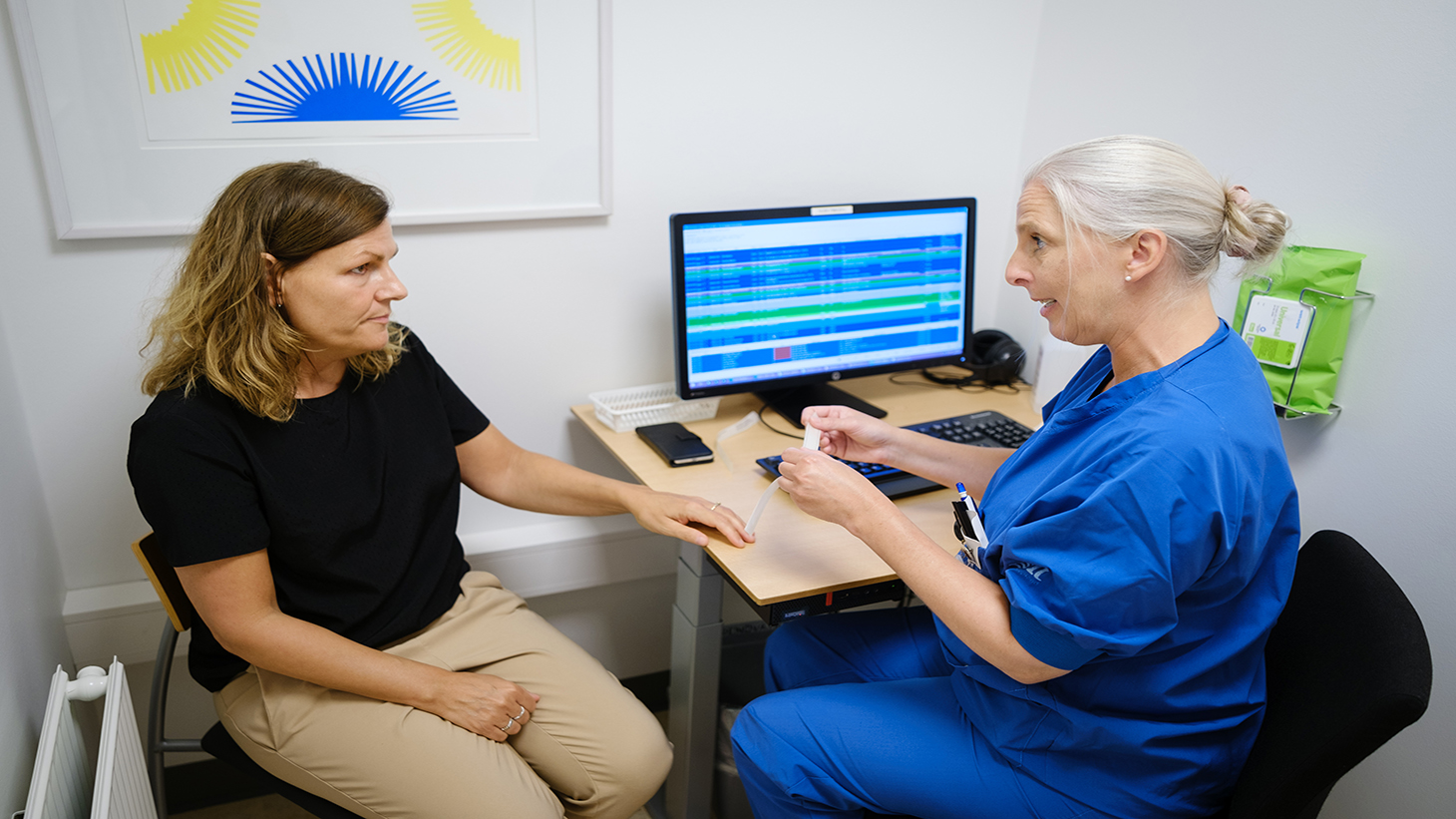 Patient taler med sygeplejerske